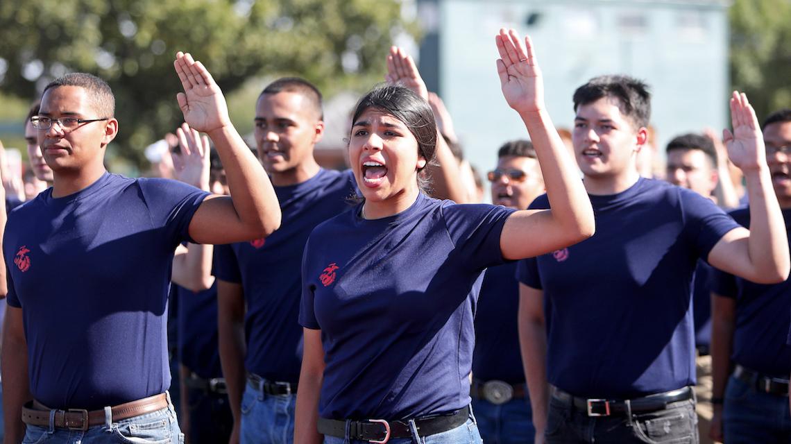 New military enlistees raising  their right hands and being sworn-in 